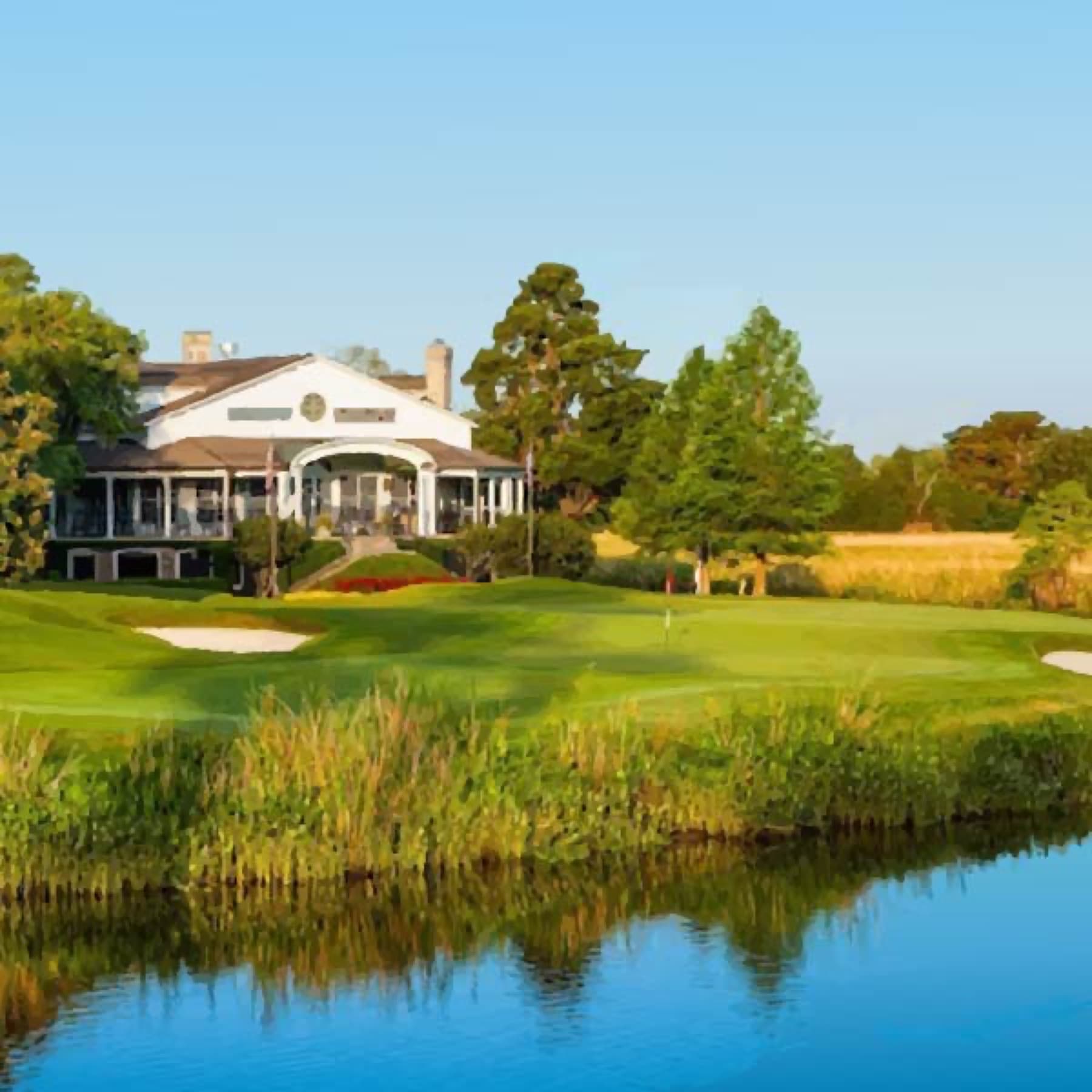 The Caledonia clubhouse, at the end of its live oak allee