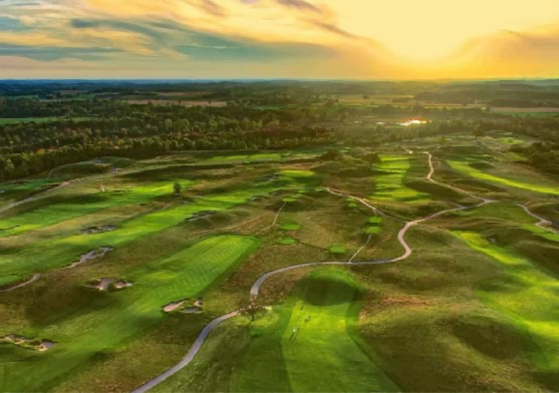 Sunset over Erin Hills' fescue and glacial terrain