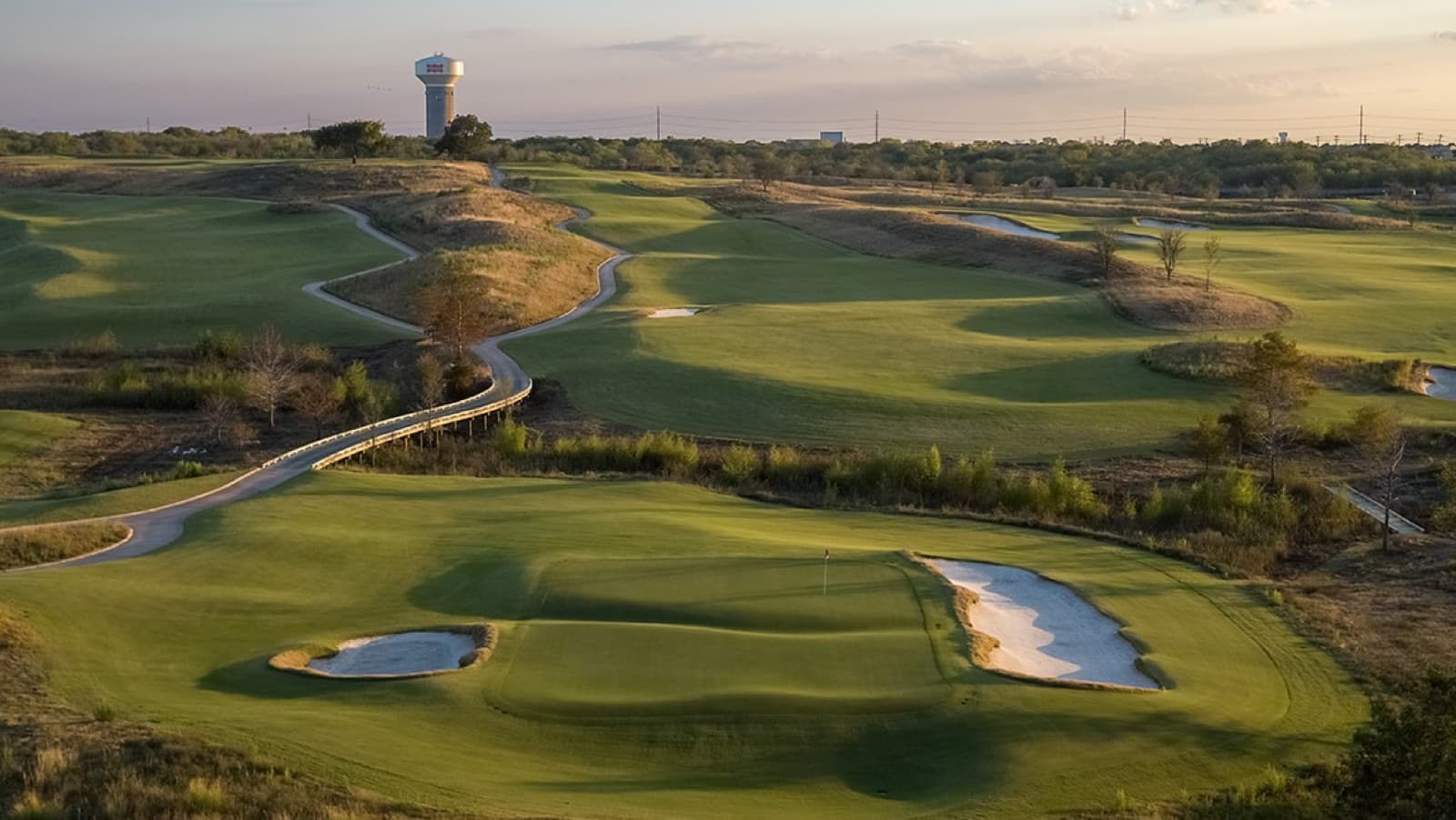 the 13th at Fields Ranch West, the PGA water tower beyond