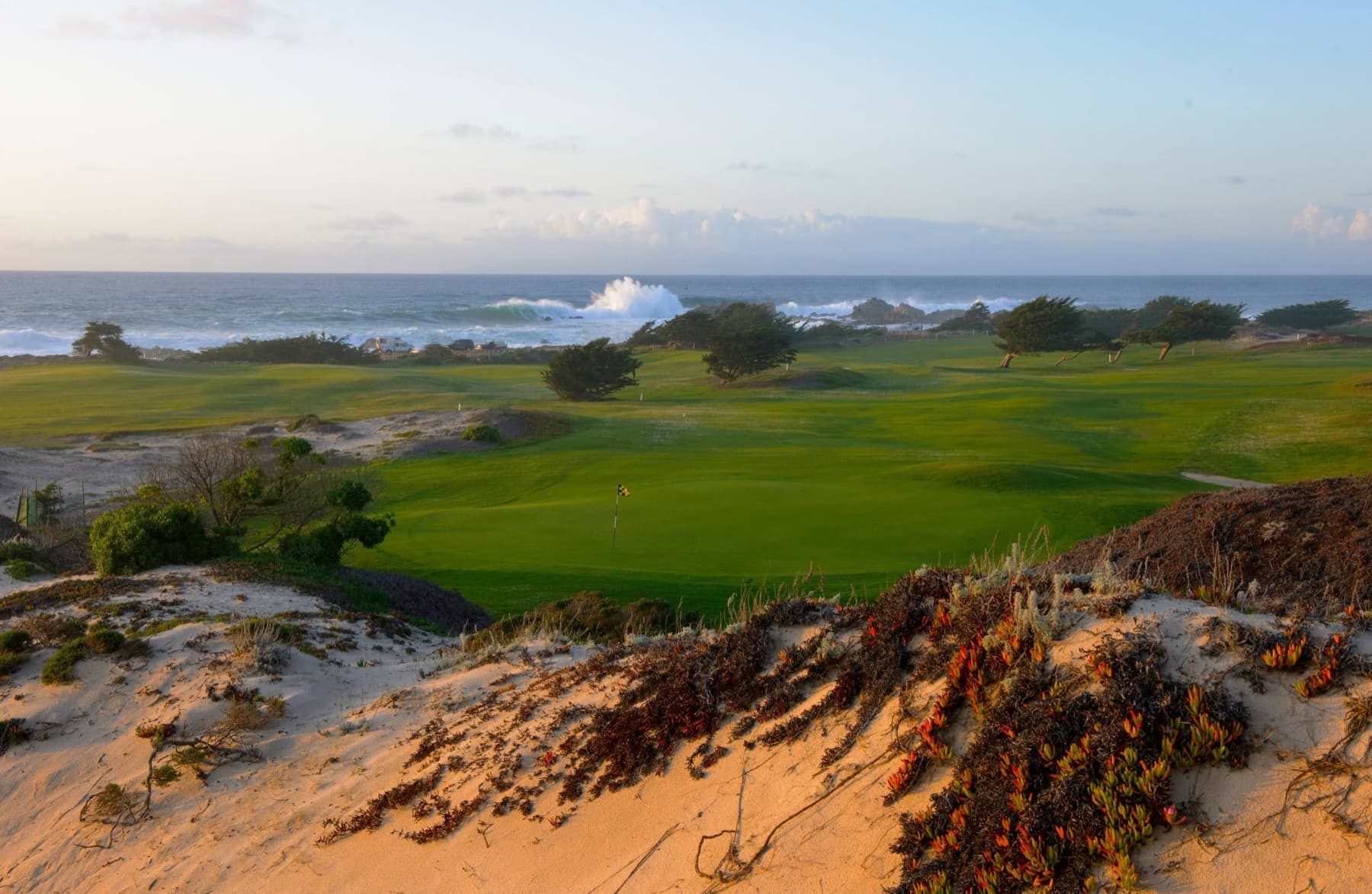 the seaside links nine at sunrise—dunes, surf, and wind-bent cypress