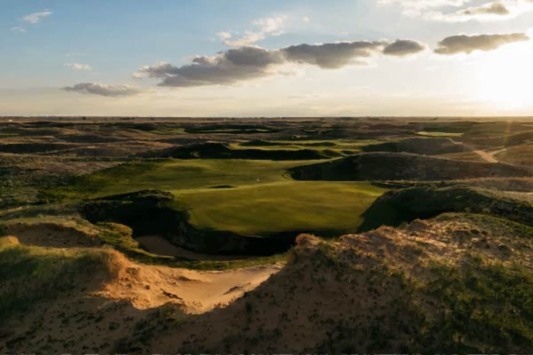 Sunset over Rodeo Dunes' dune-bowl fairways