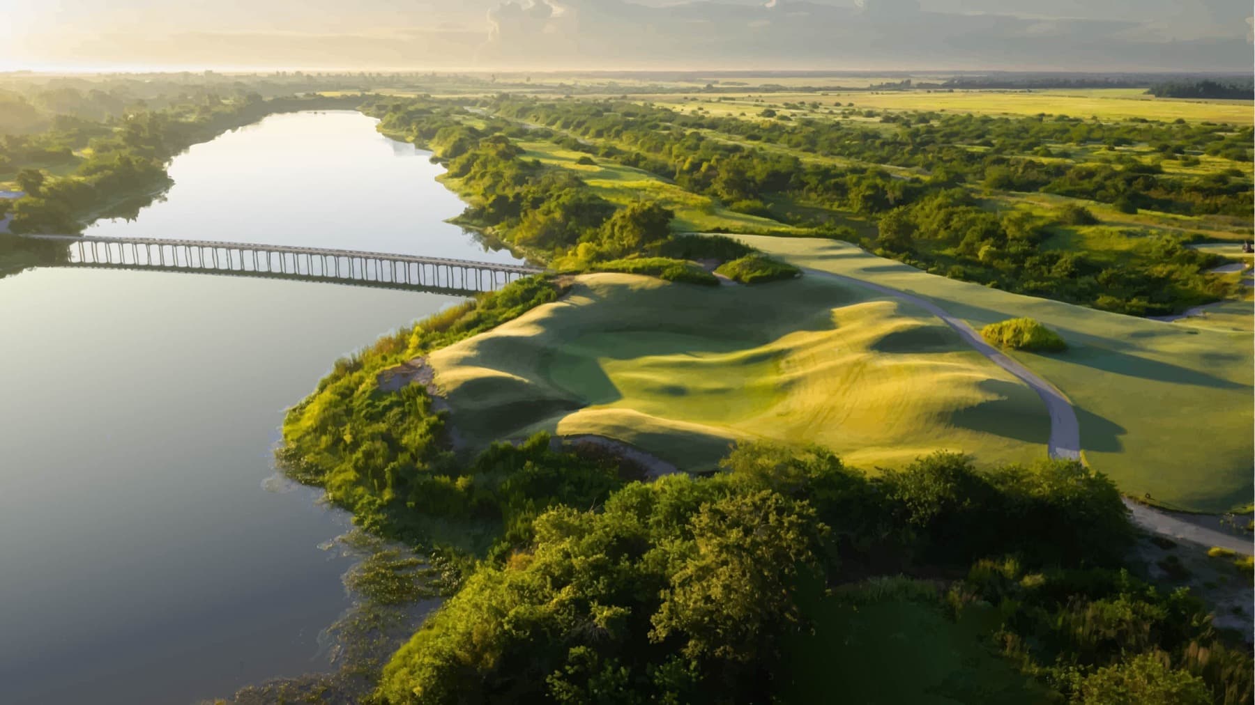 A green and boardwalk crossing at The Chain, Streamsong's short course
