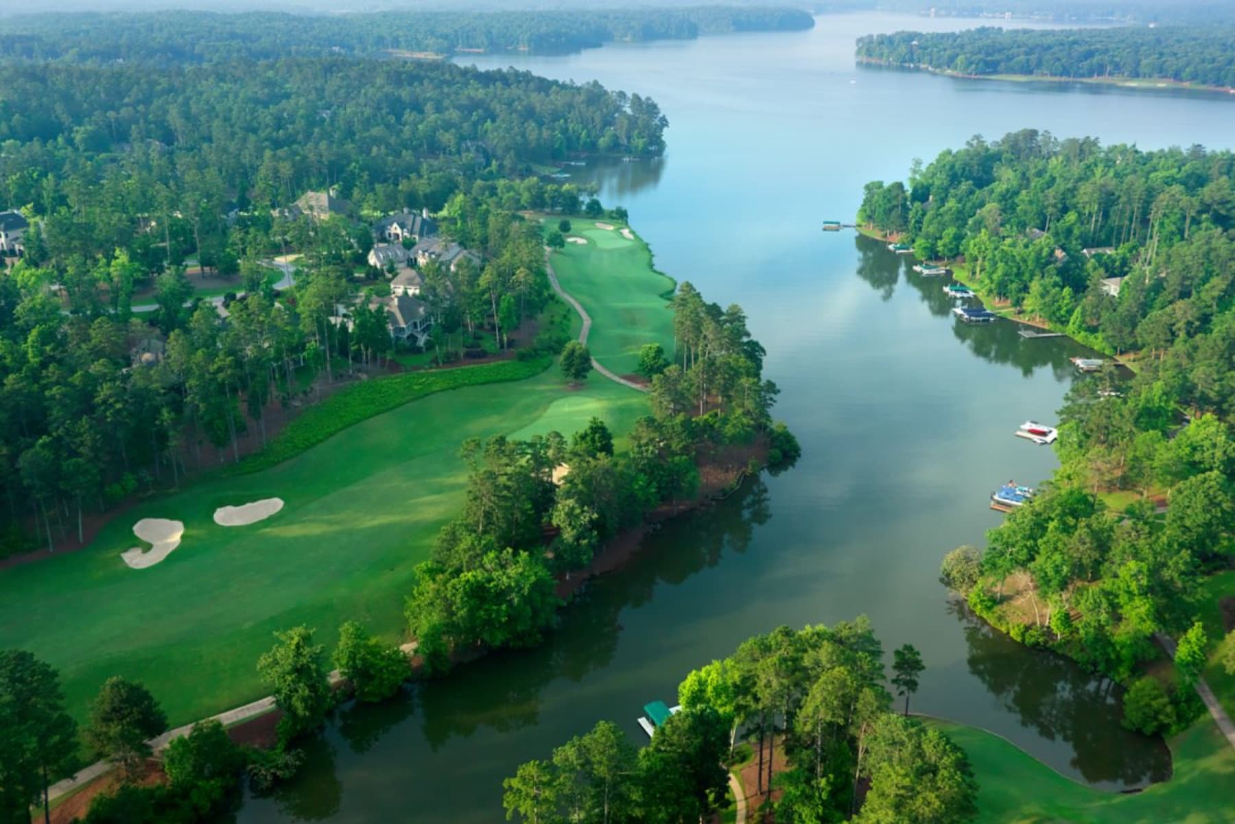 A wooded lakeside hole on The National, above a cove of Lake Oconee.