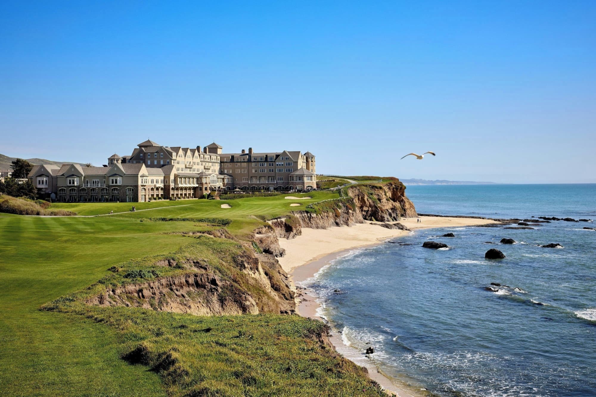 The Ritz-Carlton on the bluff, the Old Course finishing along the Pacific below.