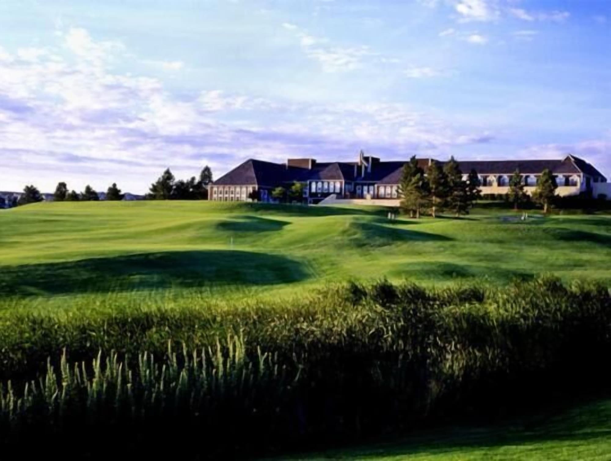 the clubhouse and hotel above the closing green