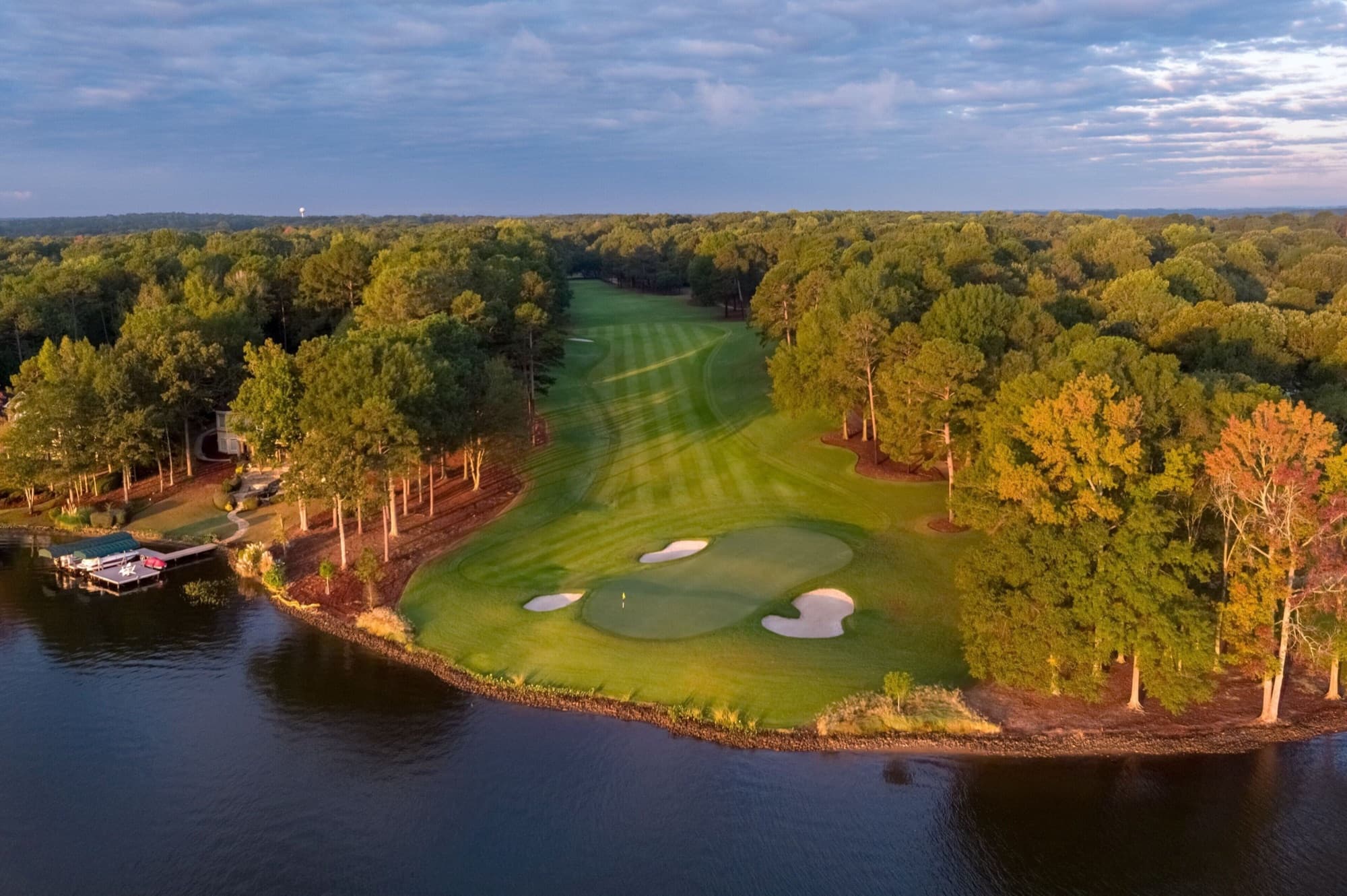A fairway sweeping to a lakeside green on the shores of Lake Oconee.